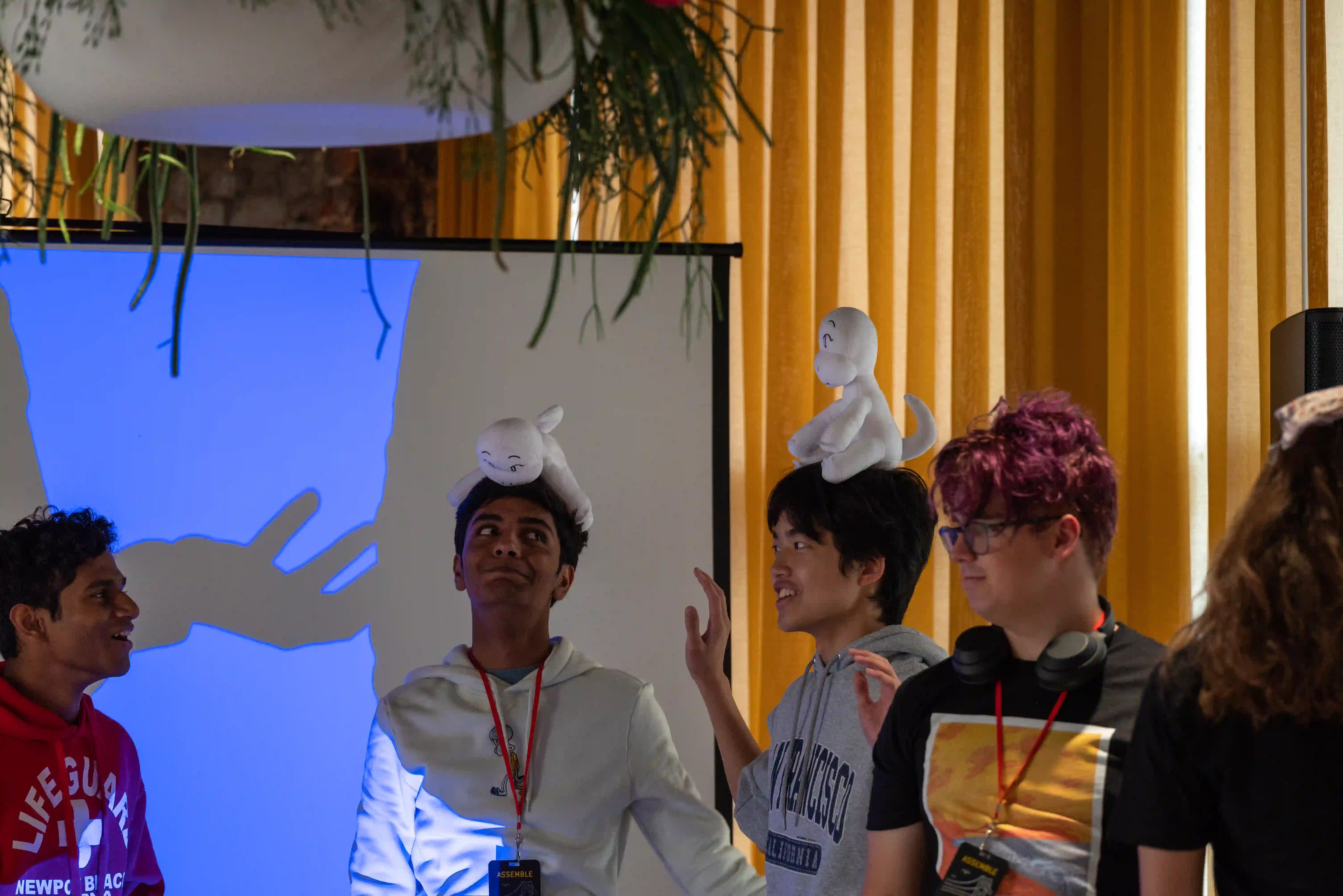 Teenagers with plushies on their heads